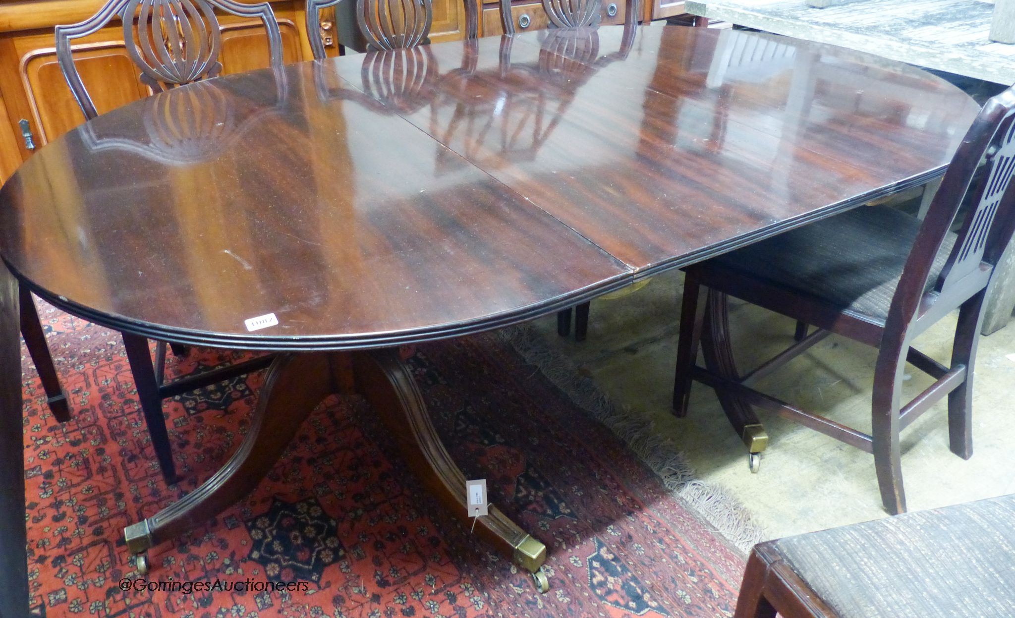 A mahogany two-pedestal dining table (one additional leaf) 186cm extended, width 114cm, height 71cm
